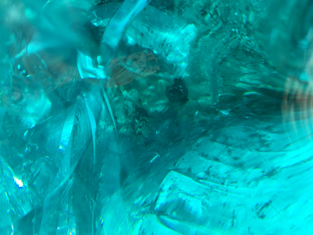 Macro of a crystalline mineral formation with metallic facets